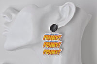 Close-up of 'PENNY!' dangle earring on a mannequin ear, black stud and comic-style lettering