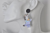 Blue heeler dog shaker earring shown worn on ear for scale