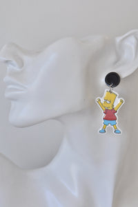 Single Bart Simpson dangle earring worn on a display ear model, showing scale and hang