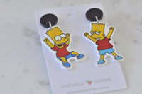 Close-up of Bart Simpson dangle earrings showing two different poses hanging from black studs