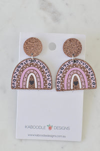 Pair of glitter leopard print rainbow drop earrings with heart detail on card backing