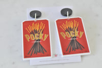 Pocky box drop earrings laid flat showing full length and black stud tops