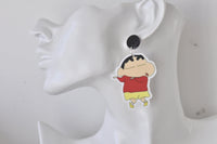 Single Shin Chan earring on ear, front view with red top and yellow shorts