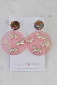 Carousel horse earrings on card, pink resin discs with glitter star studs
