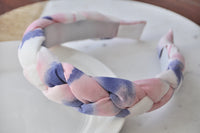 Close-up of the braided headband showing the tie-dye pattern and fabric texture