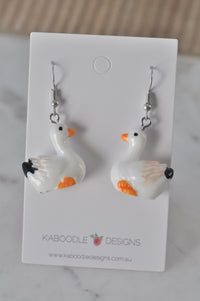 Duck drop earrings displayed on Kaboodle Designs branded card