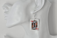 King of Hearts card earring shown worn on a model's ear for scale