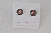 Round polkadot stud earrings in rust and cream on Kaboodle Designs card