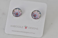 Round mandala flower stud earrings in pink, blue and cream on Kaboodle Designs card