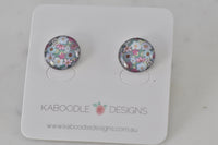 Round floral artwork stud earrings on Kaboodle Designs card, pink and blue flower pattern