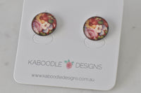 Round stud earrings with vintage floral image in pink, cream and green on Kaboodle card