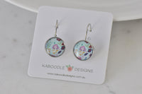 Round floral dangle earrings with pink and mint pattern on Kaboodle Designs card