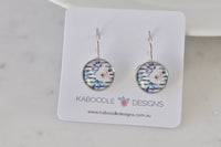 Round shabby chic floral leverback earrings on Kaboodle Designs branded card, front view