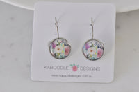 Round leverback earrings on card featuring pastel shabby chic floral print with pink and white roses