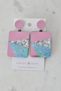 Pink, silver glitter and blue marbled acrylic rectangle drop earrings on Kaboodle card