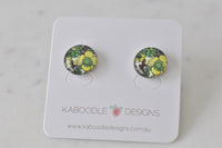 Round stud earrings on Kaboodle Designs card featuring green and yellow retro floral artwork