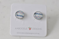 Round stud earrings with teal, cream and berry chevron pattern on a Kaboodle Designs card