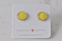 Round yellow handmade stud earrings on white Kaboodle Designs card