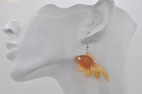 Single goldfish earring shown on ear, side view highlighting fin detail