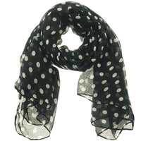 Black polka dot scarf loosely looped and draped, showing white and grey spotted print