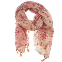 Pink floral scarf loosely looped, showing tassel ends and mandala print