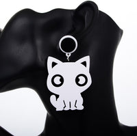 White cat-shaped earring version shown worn on ear against black mannequin bust