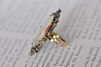 Side profile of Eiffel Tower resin ring showing domed glossy finish and ring band