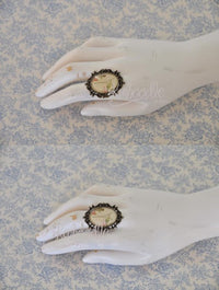 Eiffel Tower ring worn on mannequin hand, shown from two angles