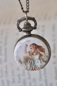 Pocket watch necklace pendant featuring Alice throwing playing cards, hanging from a chain