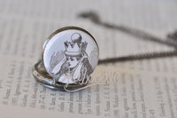 Detailed view of crowned Alice illustration on pocket watch pendant lid