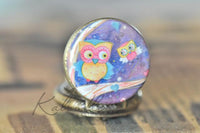 Close-up of owl friends painted artwork on the pocket watch necklace pendant