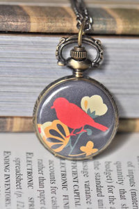 Bird and blossom pocket watch necklace pendant with red bird design and ornate brass bail