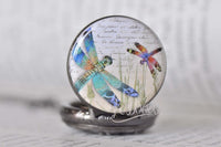 Close-up of the dragonfly design pocket watch pendant showing colourful details