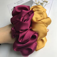 Mustard yellow scrunchie shown beside a burgundy scrunchie for colour comparison