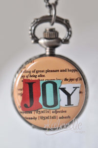 Pocket watch necklace with a colourful JOY dictionary page design on the closed lid