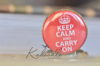 Close up of red Keep Calm and Carry On pocket watch pendant lid design