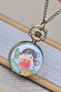 Bronze pocket watch necklace with illustrated girl and hot air balloon design