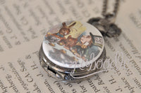 Mad Hatter tea party pocket watch pendant shown closed on a vintage book background
