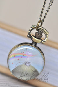 Bronze pocket watch necklace with bicycle, rainbow and heart balloon illustration