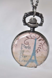 Paris script pocket watch necklace with Eiffel Tower and 'Paris Is For Lovers' design on pendant front