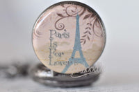 Close-up of the Paris Is For Lovers pocket watch pendant with Eiffel Tower artwork