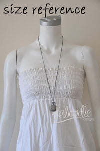 Pocket watch necklace shown worn on a mannequin to illustrate size and chain length