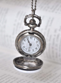 Open White Rabbit pocket watch necklace revealing the Quartz clock face inside