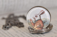 Close-up of the White Rabbit illustration inside the domed glass pocket watch pendant